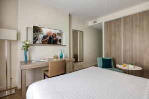 Citadines Toison d'Or Brussels客房内的一张或多张床位