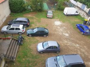 a group of parked cars parked in a yard at CHAMBRE PRIVÉE Numéro 1 dans un Superbe appartement en colocation in Montataire