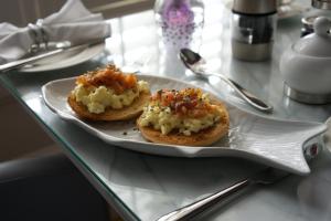 two appetizers on a plate on a table at Cartref Guest House in Carlisle