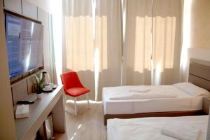 Postel nebo postele na pokoji v ubytování Isar City Hotel