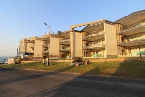 an apartment building on the side of a street at Saints View Resort Unit 1 in Uvongo Beach