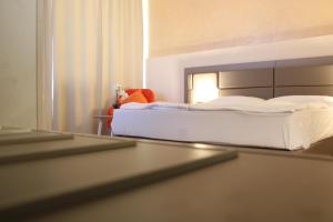 Postel nebo postele na pokoji v ubytování Isar City Hotel