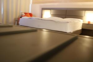 Postel nebo postele na pokoji v ubytování Isar City Hotel