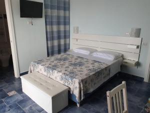 A bed or beds in a room at La Casa di Nunzia B&B