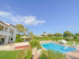 a swimming pool in front of a house at Villa Saint Maxime in Saint Paul de Vence