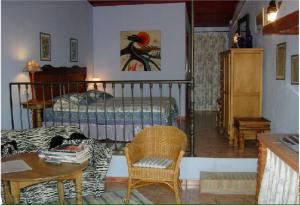 A bed or beds in a room at Cortijo Zalamea