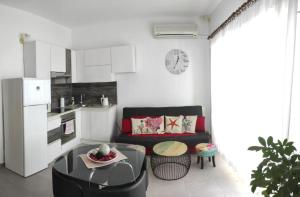 a living room with a couch and a table at Apartments Sollis in Trogir