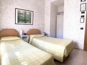 Postel nebo postele na pokoji v ubytování Hotel Molise 2