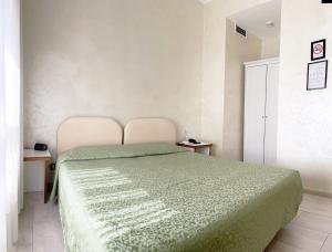 Postel nebo postele na pokoji v ubytování Hotel Molise 2