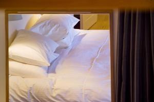 Posteľ alebo postele v izbe v ubytovaní Enastron Guesthouse