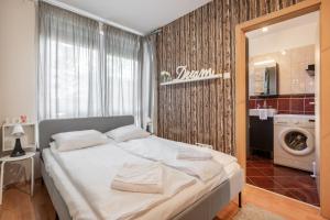 Posteľ alebo postele v izbe v ubytovaní Green Lush Apartment