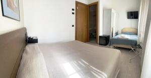 Postel nebo postele na pokoji v ubytování Hotel Molise 2