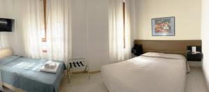 Postel nebo postele na pokoji v ubytování Hotel Molise 2