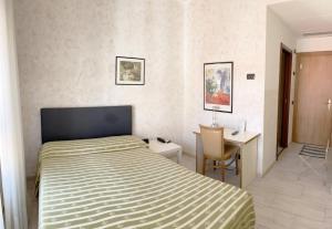 Postel nebo postele na pokoji v ubytování Hotel Molise 2