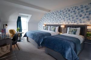 Tempat tidur dalam kamar di Kilkenny Ormonde Hotel