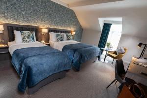 Tempat tidur dalam kamar di Kilkenny Ormonde Hotel