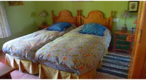 A bed or beds in a room at Cortijo Zalamea