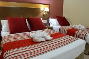 Posteľ alebo postele v izbe v ubytovaní Hotel Regio 2