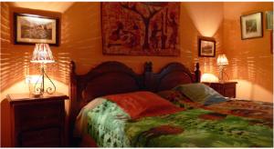 A bed or beds in a room at Cortijo Zalamea
