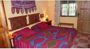 A bed or beds in a room at Cortijo Zalamea