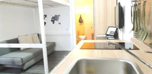A television and/or entertainment centre at TREND APARTMENTS
