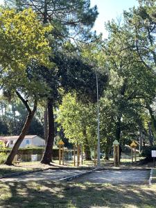 a park with a street light and trees at Maison au cœur de la La Palmyre in Les Mathes