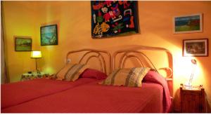 A bed or beds in a room at Cortijo Zalamea