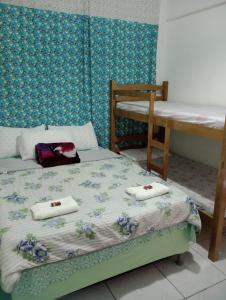a bedroom with a bed with towels on it at Pousada La Duna Lençóis Maranhenses in Barreirinhas +57 photos