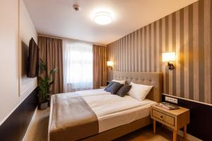 Posteľ alebo postele v izbe v ubytovaní AR Apartamenty