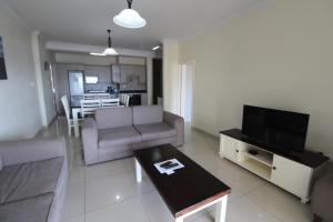 Televisyen dan/atau pusat hiburan di Saints View Resort Unit 21