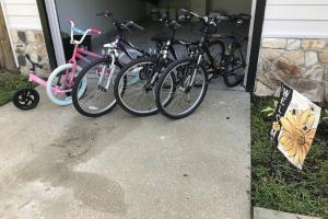 a group of bikes parked next to a house at Honey Bee Hideaway in Fleming Island
