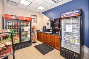 a grocery store with two refrigerators in a store at Oceanfront Studio Condo With Balcony View Of Beach And Ocean In Daytona Beach Resort 1011 With 4 Pools Tiki Bar Grill in Daytona Beach