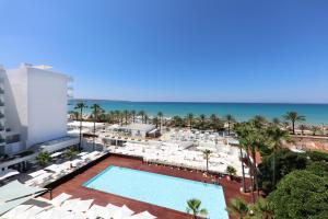 an aerial view of a resort with a swimming pool and the beach at Iberostar Waves Bahía de Palma - Adults Only in Playa de Palma