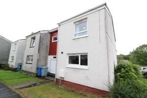 a row of houses on the side of a street at Signature - Carnoustie House in East Kilbride