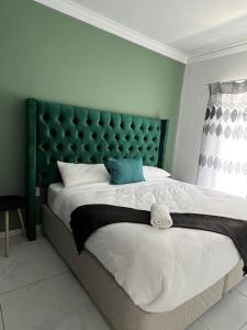 Ένα ή περισσότερα κρεβάτια σε δωμάτιο στο Aloe Apartments