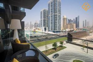a balcony with a view of a city at Keysplease 2 BR minutes to Dubai Mall 408, City Walk in Dubai