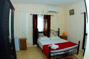 Postel nebo postele na pokoji v ubytování Magtas Hotel