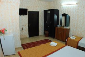 Postel nebo postele na pokoji v ubytování Magtas Hotel
