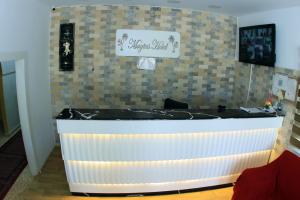 TV a/nebo společenská místnost v ubytování Magtas Hotel