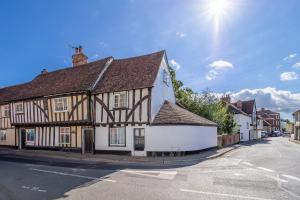 an old building on the corner of a street at Angelic 16th Century cottage in key Constable village - Bear Cottage in Nayland