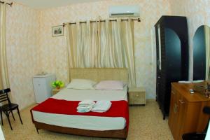 Postel nebo postele na pokoji v ubytování Magtas Hotel
