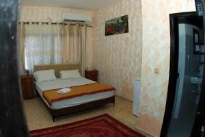Postel nebo postele na pokoji v ubytování Magtas Hotel