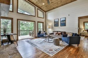 a living room with a couch and a table at NEW Modern Cabin! 2 Large Decks, Hot Tub, Sleeps 8 in Ellijay +51 photos