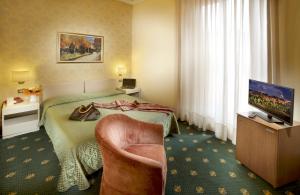 Katil atau katil-katil dalam bilik di Grand Hotel Plaza & Locanda Maggiore