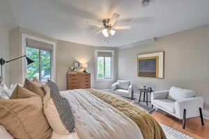a bedroom with a bed and a ceiling fan at Stunning Queen Anne House with Private Patio! in Seattle