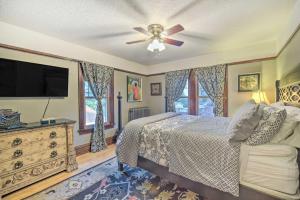 a bedroom with a bed and a flat screen tv at Elegant Superior Getaway Less Than 2 Mi to Downtown! in Superior