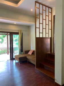 Postel nebo postele na pokoji v ubytování บ้านธานี (BAAN THANI)