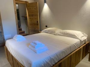 Postel nebo postele na pokoji v ubytování Chalet Monfol Superior