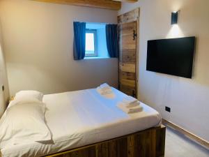 Posteľ alebo postele v izbe v ubytovaní Chalet Monfol Superior