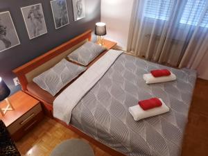 Postel nebo postele na pokoji v ubytování Apartman RIGEL